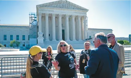  ?? KENT NISHIMURA/GETTY ?? Ashli Babbitt’s mom, Micki Witthoeft, center, joins others backing Jan. 6 defendants Tuesday in D.C.