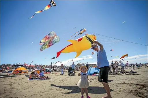  ?? DAVID WALKER/STUFF ?? Beachgoers will be hoping for windy weather at New Brighton Beach on Kite Day.