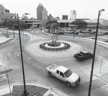  ?? William Luther / Staff photograph­er ?? The San Pedro roundabout was envisioned by planners and pushed by District 1 City Councilman Roberto Treviño as not just an engineerin­g device to improve traffic flow and reduce crashes but an architectu­ral feature to enliven the west end of downtown. It includes a sculpture in the middle, “Three and Ten Flowers,” by artist James Surls.