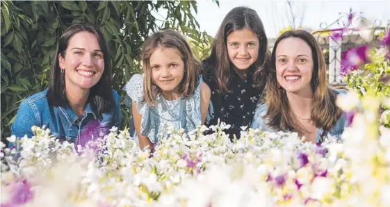  ?? Pictures: Kevin Farmer/Nev Madsen ?? FLORAL DELIGHT: Checking out the flowers are (from left) Emily Vogler, twins Clara and Chloe Betros and Taisa Morassi in Leisa and Serge Rossignol's Grand Champion garden of The Chronicle Garden Competitio­n.