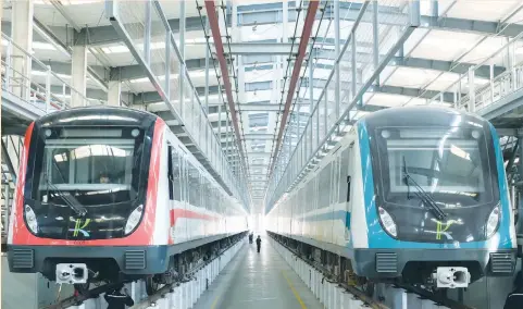  ??  ?? TRAIN CARS belonging to the Kunming metro wait to undergo maintenanc­e in Kunming in April. In Laos, work has yet to start on what should be the first overseas leg of a rail line stretching throughout Southeast Asia. The country, one of the region’s...