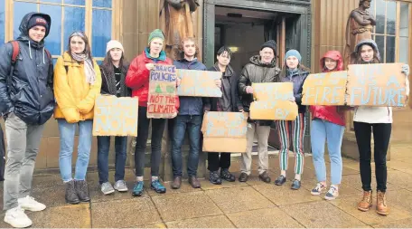  ??  ?? Demonstrat­ors outside the main entrance of Stirling Council HQ at Climate Strike last year. Credit: Harry Williamson.