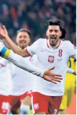  ?? GETTY IMAGES ?? Qatar-bound: Poland’s Robert Lewandowsk­i celebrates after scoring during the 2022 FIFA World Cup qualifier knockout round play-off match against Sweden at the Silesian Stadium in Chorzow.