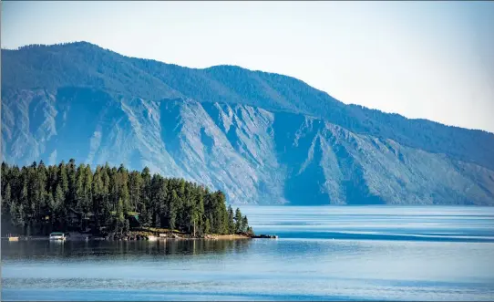  ??  ?? Buy 20 acres of prime real estate in Montana for $590,000. The property comes with a newly built 2,400-square-foot shop. Lake Pend Oreille, Idaho’s largest lake, is just 30 minutes from the property for sale.