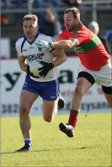  ??  ?? Dean Healy comes away with the ball as James Stafford closes in.