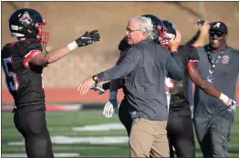  ?? PHOTO BY JIM GENSHEIMER ?? Aragon head coach Steve Sell, seen getting a hug from Ross Victor after a game in 2021, is troubled by the Supreme Court's ruling about prayer on the football field.