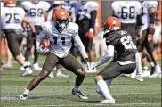  ?? AP ?? Browns receiver Antonio Callaway gets by Phillip Gaines during Saturday’s practice. Callaway, a secondyear player, might have to stand in line for passes with veterans Odell Beckham Jr. and Jarvis Landry around.