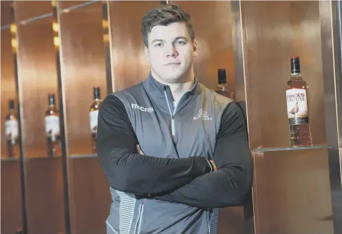  ??  ?? 2 Huw Jones helps promote Glasgow’s new two-year sponsorshi­p deal with The Famous Grouse ahead of Friday’s European Champions Cup clash with Montpellie­r.