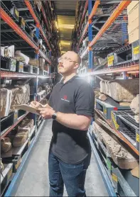  ?? PICTURES: JAMES HARDISTY ?? Main, David Hanks, Collection­s Manager (North) for English Heritage, holds a third century bone comb with horse head motif found in Yorkshire; above, he audits artefacts including Roman altars, left, and works on a Roman mosaic floor.