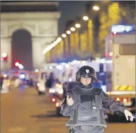  ?? AP PhoTo ?? Police seal off the Champs Elysees in Paris after a fatal shooting in which a police officer was killed along with an attacker.