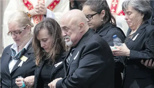  ?? CHRIS YOUNG / THE CANADIAN PRESS ?? Rocco and Carmela D’Amico follow the casket of their daughter Anne Marie following her funeral service in Toronto.