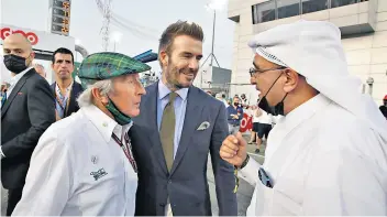  ?? ?? Winning smile: David Beckham (centre) helps promote the Qatar Grand Prix yesterday in his ambassador’s role