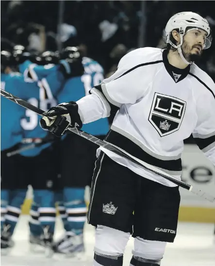 ?? BEN MARGOT/THE ASSOCIATED PRESS ?? Los Angeles Kings defenceman Drew Doughty turns away as San Jose Sharks teammates celebrate a power-play goal by Patrick Marleau during the third period on Wednesday night. The Sharks won the game 3-2, scoring all three of their goals on the power play.