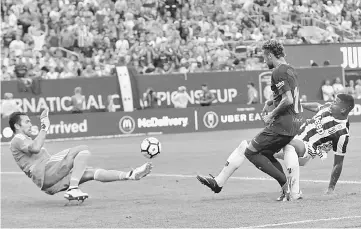  ??  ?? Barcelona’s Neymar shoots as Juventus’ Gianluigi Buffon makes save during the Internatio­nal Champions Cup 2017 at MetLife Stadium in East Rutherford, New Jersey. — Reuters photo