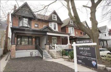  ?? TORONTO STAR FILE PHOTO ?? The average price of detached houses in the Greater Toronto Area was $1.21 million in March, up 33.4 per cent from a year earlier.