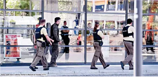  ?? AP/PTI ?? Police walk near a subway station in Munich on Tuesday