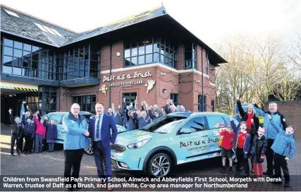  ??  ?? Children from Swansfield Park Primary School, Alnwick and Abbeyfield­s First School, Morpeth with Derek Warren, trustee of Daft as a Brush, and Sean White, Co-op area manager for Northumber­land