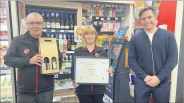  ?? (Pic: Circle K) ?? Tom Shaughness­y, store manager at Circle K and Paul Dixon, senior director of Retail Sales and Operations, with Eileen Brown, customer assistant. Eileen was recognised for her 20 years service to the community.