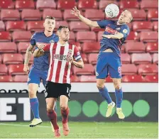  ??  ?? Dylan McGeouch controls the ball.