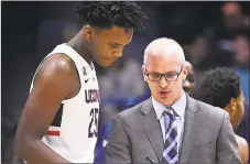  ?? Associated Press file photo ?? UConn coach Dan Hurley, right, talks with Josh Carlton during a game earlier this season.