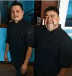  ?? PHOTOS BY JONATHAN WIGGS/GLOBE STAFF ?? The calamari (top) and meatballs (above left) at Ciao Amici in Wakefield. Above: Chefowners Gabriel Perez (left) and Huberto Melara were boyhood friends in El Salvador. Bottom left: the interior of the restaurant.