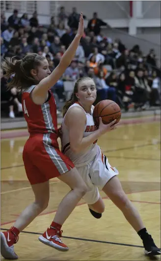  ?? PAUL DICICCO — FOR THE NEWS-HERALD ?? Avril Drew of North drives to the hoop during the Rangers’ 66-48win over Mentor in a Division I district semifinal at Perry on Feb. 25.