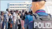  ?? AP ?? Migrants disembark at the Reggio Calabria harbour.