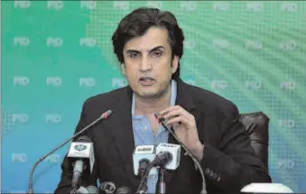  ?? -APP ?? Federal Minister for Planning, Developmen­t and Reform Makhdoom Khusro Bukhtiar addressing a press conference.