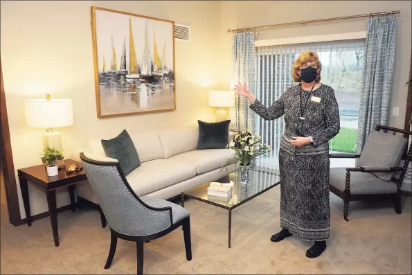  ?? Ned Gerard / Hearst Connecticu­t Media ?? Carol Maddock, manager of the River Valley Retirement Community in Trumbull, speaks in one of the apartments in the new facility during a tour on Thursday.