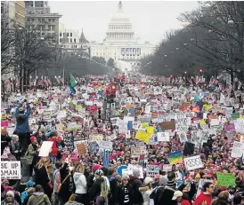  ?? /AFP (See Page 4) ?? Women against Trump: A huge crowd of protesters walks up Pennsylvan­ia Avenue during the Women's March, in Washington, DC, at the weekend following the US president’s inaugurati­on.