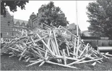  ?? FRANK GUNN/THE CANADIAN PRESS ?? Wooden crosses representi­ng the 1,265 Ontarians who lost their lives in 2017 to overdoses were placed on the lawn as a sign of protest at Queen’s Park in Toronto on Monday.