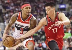  ?? The Canadian Press ?? Toronto Raptors guard Jeremy Lin (17) tries to steal the ball from Washington Wizards guard Bradley Beal (3) during second-half NBA action in Toronto on Wednesday.