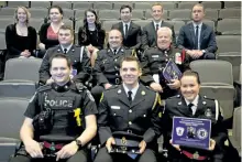  ?? JASON BAIN/EXAMINER ?? Recipients of Fleming College Outstandin­g Police Officer Service Awards were, from left in front, Port Hope police Const. Morgan Stout, Peterborou­gh County OPP Det. Const. Jason Clarke, Port Hope police Const. Dana Barr, and from left in the middle, Peterborou­gh police Const. Cam Kenny, Haliburton Highlands OPP Const. Tim Negus and Cobourg Police Sgt. Michael Richardson on Monday. Police foundation­s students (third row) introduced the officers as the third annual awards were handed out at Sutherland Campus.