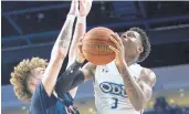  ?? STAFF FILE ?? Old Dominion’s Malik Curry, right, was cleared to practice Tuesday after being evaluated for a concussion.