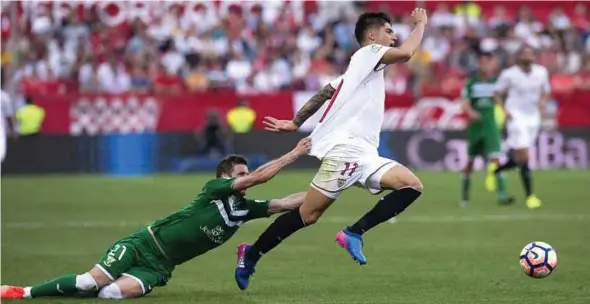  ?? EPA PIC ?? Leganes’ Ruben Perez (left) fouls Sevilla’s Joaquin Correa at Ramon Sanchez-Pizjuan’s Stadium on Saturday.