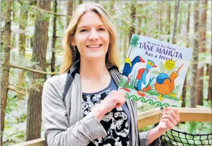  ??  ?? Rebecca Larsen with her second children’s book, November 2. to be launched in Te Puke on