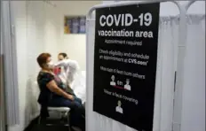  ?? Marcio Jose Sanchez/Associated Press ?? A patient receives a shot of the Moderna COVID-19 vaccine March 1 in Los Angeles. The Biden administra­tion said Friday that it’s focused on getting the guidance for those who have been vaccinated right and accommodat­ing emerging science.