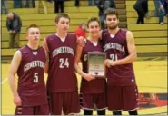  ?? THOMAS NASH — DIGITAL FIRST MEDIA ?? Conestoga captains, from left, Colin McFillin, Mike Erickson, Zach Lezanic and Charlie Schappell pose with the plaque after winning the Boyertown Holiday Tournament championsh­ip game.