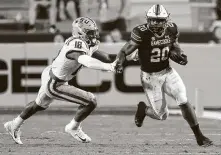  ?? Brett Duke / Associated Press ?? South Carolina’s Kevin Harris, running against LSU, is the No. 2 rusher in the SEC and faces Texas A&M on Saturday.