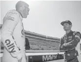  ?? SEAN GARDNER/GETTY ?? Kyle Larson, right, and Alex Bowman talk at practice for the DuraMAX Drydene 400 Saturday at Dover Motor Speedway in Dover, Delaware.