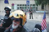  ?? ARIEL SCHALIT / AP ?? The Samson Riders, an Israeli motorcycle club, arrive at the new US embassy in Jerusalem on Sunday after a ride from the old embassy in Tel Aviv, before the embassy’s Monday opening.