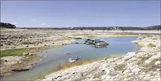  ?? PHOTOS BY JAY JANNER / AMERICAN-STATESMAN ?? BEFORE: West Beach Cove on Lake Travis on Oct. 1, 2013.“The lake has been low for so many years, I think it’s going to be a madhouse,”said Travis County Parks’ Dan Perry.