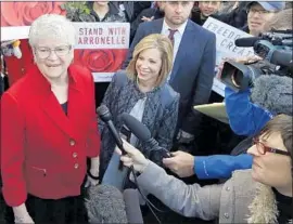  ?? Elaine Thompson Associated Press ?? BARRONELLE STUTZMAN, left, told a flower customer that she could not help with his impending wedding “because of my relationsh­ip with Jesus Christ.”