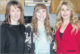  ?? JIM DAY/SALTWIRE NETWORK ?? Family and Human Services Minister Tina Mundy, right, praises Blooming House co-founders Brynn Devine, left, and Liz Corney for filling a void by opening a women’s shelter in Charlottet­own. The province announced $60,000 in funding support for the initiative on Monday.