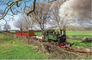  ?? BARBARA FULLER ?? The Talyllyn Railway managed to complete most planned trains chartered by David Williams between March 16-18 before deciding against public opening because of the coronaviru­s outbreak. The railway’s 0-4-2T No. 7 Tom Rolt pulls a mixed train into Rhydyronen, where the vista has been opened up following removal of some trees. The image also shows work in progress by the line’s hedge-laying team.