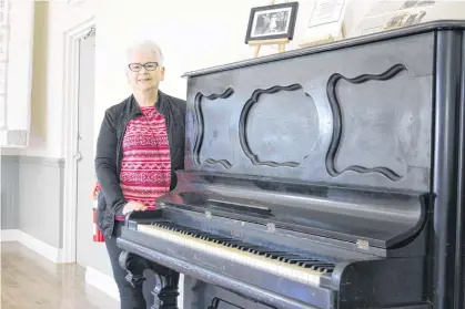  ?? KRISTIN GARDINER • JOURNAL PIONEER ?? Brenda Boudreau, president of the Victoria Historical Associatio­n, helped breathe new life into the 125-year-old piano.