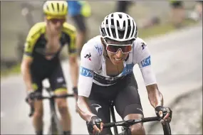  ?? Marco Bertorello / AFP / Getty Images ?? Colombia’s Egan Bernal, right, wearing the best young rider’s white jersey, launches an attack followed by Great Britain’s Simon Yates in a breakaway during the 19th stage of the Tour de France on Friday.