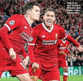  ??  ?? Take it as red: scorers Firmino and Mane enjoy themselves