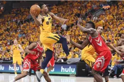  ?? (Chris Nicoll-USA TODAY Sports/Reuters) ?? UTAH JAZZ guard Donovan Mitchell (45) drives to the basket against Houston Rockets center Clint Capela in game four of the second round of the 2018 NBA Playoffs.