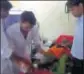  ?? HT PHOTO ?? Doctors stitch up a patient as another holds a torch in Karauli’s Hindaun.